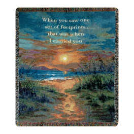 Printed throw blanket with a sunset beach scene and memorial quote