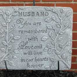 Decorative memorial plaque with the words "Husband, You are remembered with love and will live in our hearts forever."