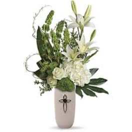 White lilies and roses in a tall beige vase
