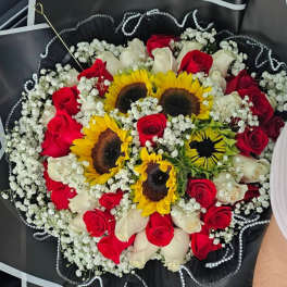 Bouquet of red and white roses with sunflowers and baby's breath