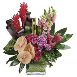 Tropical bouquet with pink roses, anthuriums, and red ginger in a glass vase