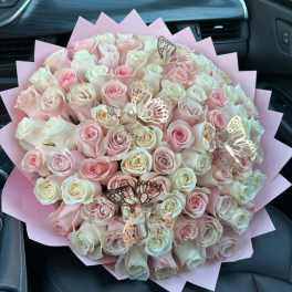Large bouquet of pale pink and white roses with butterfly picks