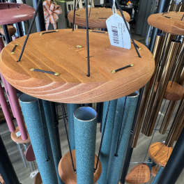 Hanging wind chimes with wooden tops and blue tubes
