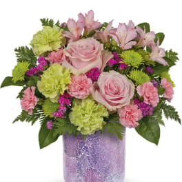 Pink roses and alstroemeria in a purple mosaic vase
