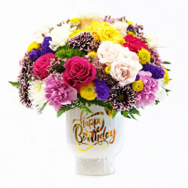 Mixed bouquet in a white vase with a Happy Birthday message