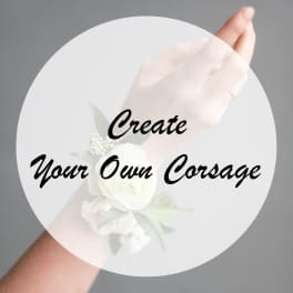 Hands holding a white corsage with small flowers