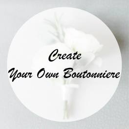 White boutonniere with a small flower and greenery