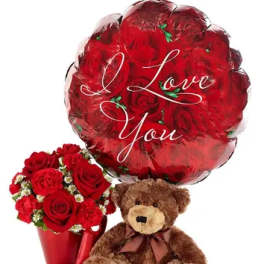 Red rose bouquet with a heart balloon and teddy bear