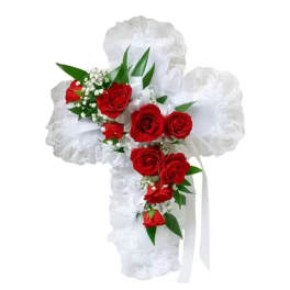 White floral cross with red roses and ribbon
