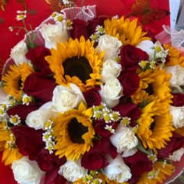 Bouquet of red and white roses with yellow sunflowers