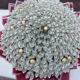 Bouquet made of folded dollar bills with gold-wrapped chocolates