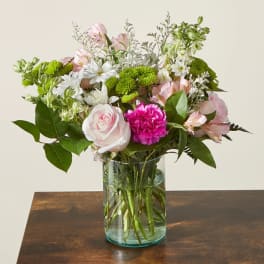 Pink and white mixed bouquet in a clear glass vase