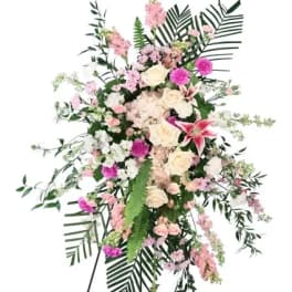 Standing floral spray with pink and white flowers on an easel