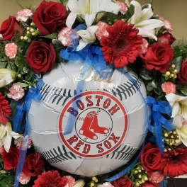 Red and white floral wreath around a Boston Red Sox balloon