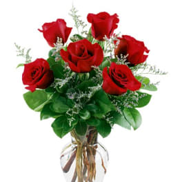 Bouquet of red roses in a clear glass vase