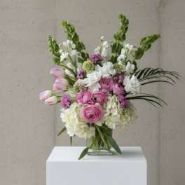 Pink and white mixed bouquet in a clear glass vase