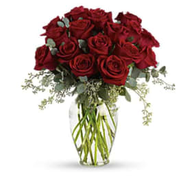 Bouquet of red roses in a clear glass vase