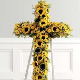 Yellow sunflower cross on a white stand