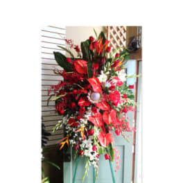 Tall red floral standing spray on an easel