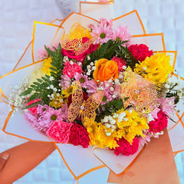 Bright mixed bouquet with pink, yellow, and orange flowers