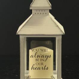 White lantern with a memorial message card inside