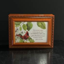Framed memorial plaque with a cardinal and sympathy message