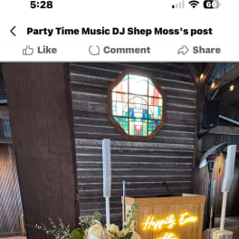 White rose centerpiece in a clear glass bowl on a table