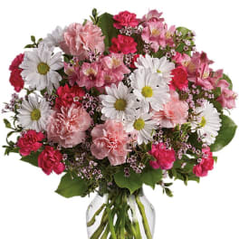 Pink and white mixed bouquet in a clear glass vase