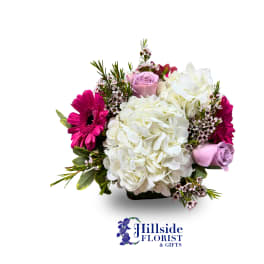 Bouquet of white hydrangea, pink gerberas, and lavender roses