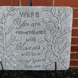 Decorative stone plaque with the words "WIFE You are remembered with Love and will live in our hearts forever"