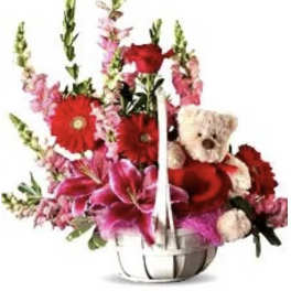 Bouquet of red and pink flowers with a teddy bear in a silver basket