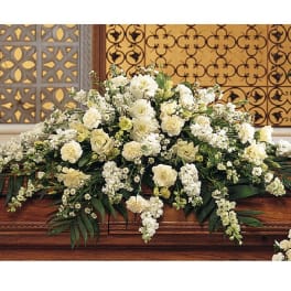 White floral casket spray with cascading blooms