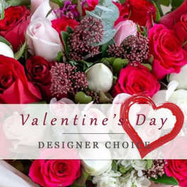 Bouquet of red, pink, and white roses with a Valentine's Day label