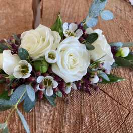 White rose bouquet with small white blossoms and eucalyptus