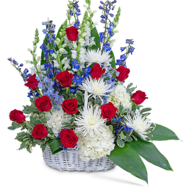Basket arrangement of red roses, white chrysanthemums, and blue flowers