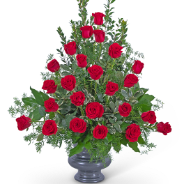 Tall bouquet of red roses in a gray vase