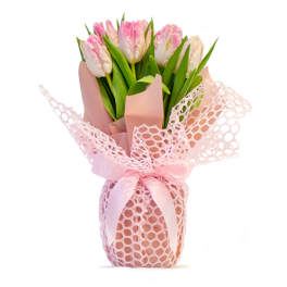Pink and white tulips wrapped in blush paper with pink mesh and ribbon