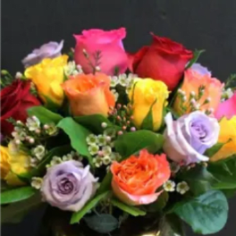 Bouquet of multicolored roses with small white filler flowers