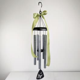 Hanging metal wind chime with a green ribbon and butterfly pendant