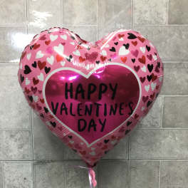 Pink heart-shaped balloon with "Happy Valentine's Day" text