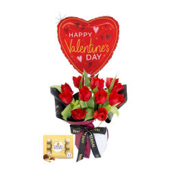 Red tulip bouquet with a heart-shaped Valentine balloon and chocolates
