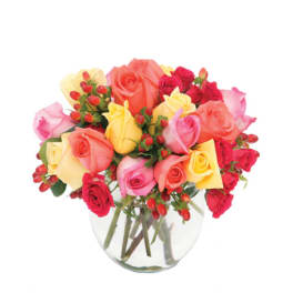 Bouquet of multicolored roses in a clear glass vase