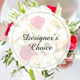 Mixed bouquet of red and white roses with greenery