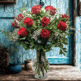 Bouquet of red roses in a clear glass vase