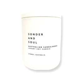 White candle jar labeled Sonder and Soul