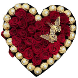 Heart-shaped box of red roses with gold-wrapped chocolates and butterfly decorations