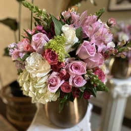 Pink and white mixed bouquet in a metallic vase