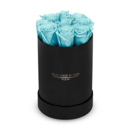 Blue roses in a black round box