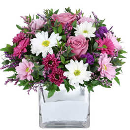 Pink and white mixed bouquet in a clear square vase