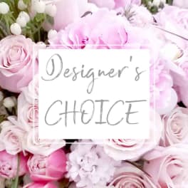 Pink roses and peonies with white blossoms in a close-up floral arrangement